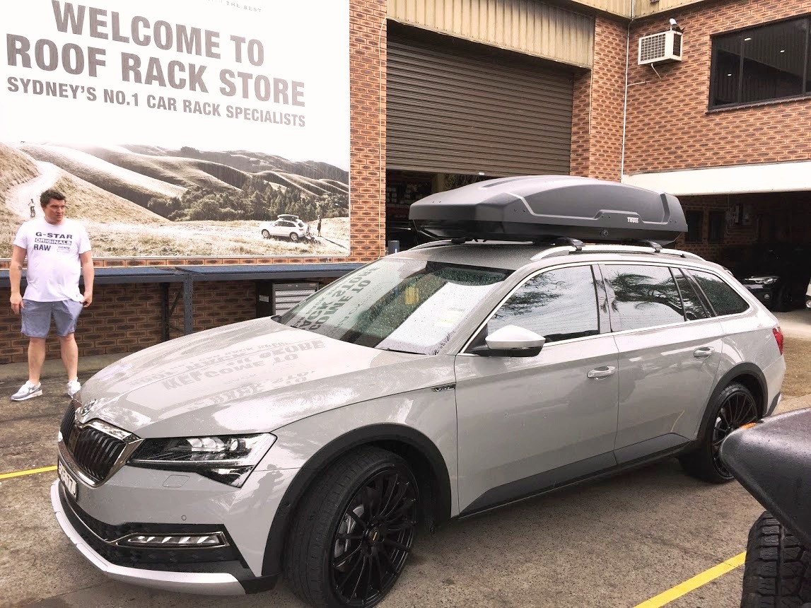 Skoda Superb With Thule Force XT XL Roof Box On Thule Edge Roof Rack